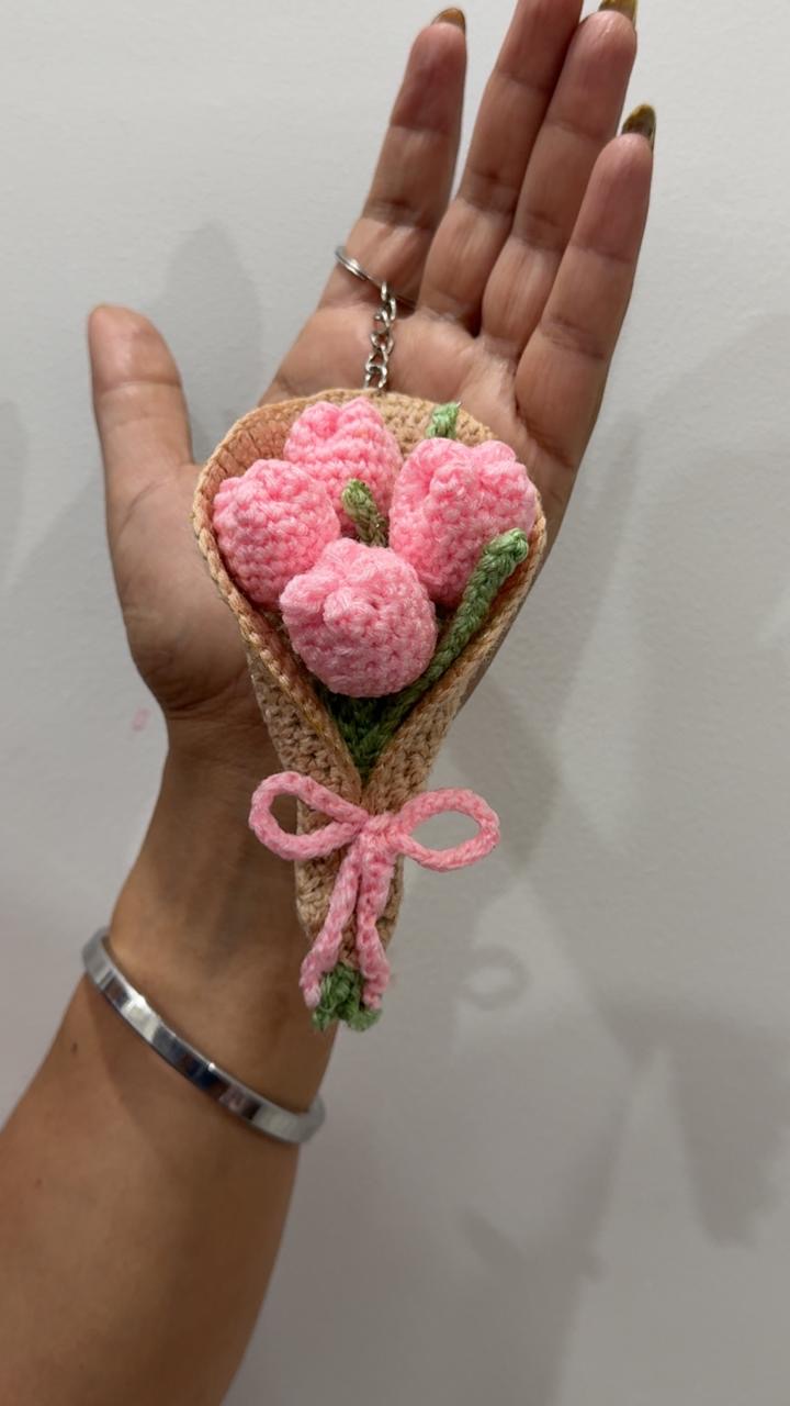Crochet keychain shaped like a small posy of pink tulips